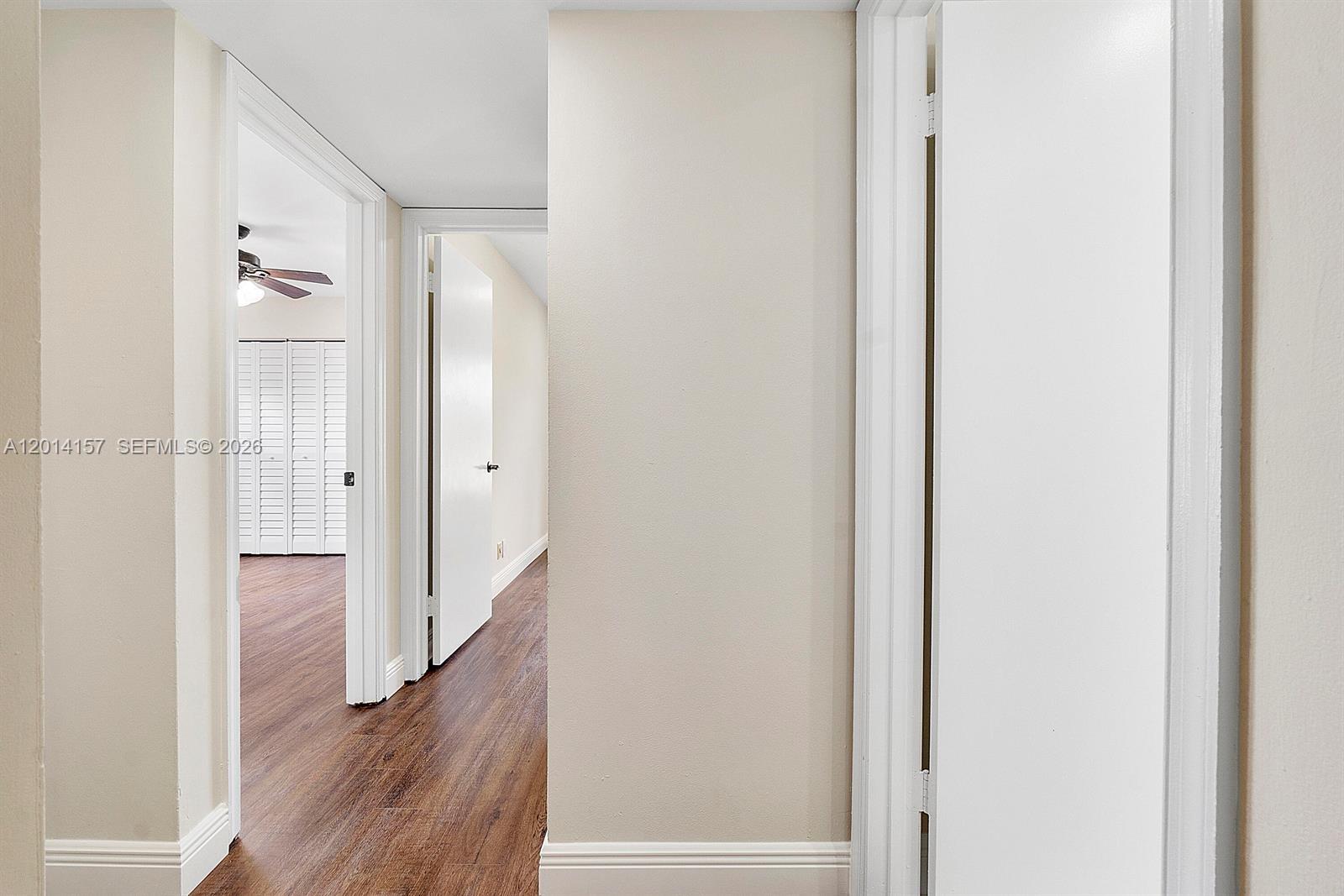 7744 Courtyard Run West Boca Raton, FL 33433 - Photo 8 of 25 a view of a hallway with wooden floor
