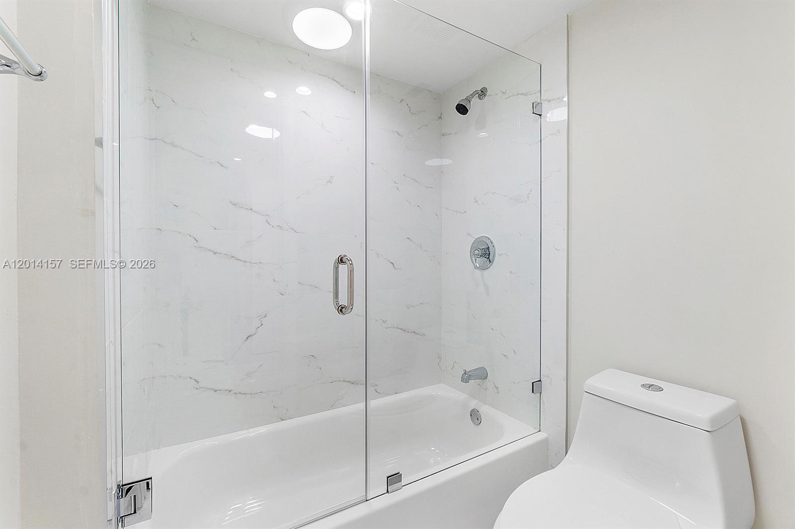 7744 Courtyard Run West Boca Raton, FL 33433 - Photo 10 of 25 a bathroom with a bathtub and a toilet