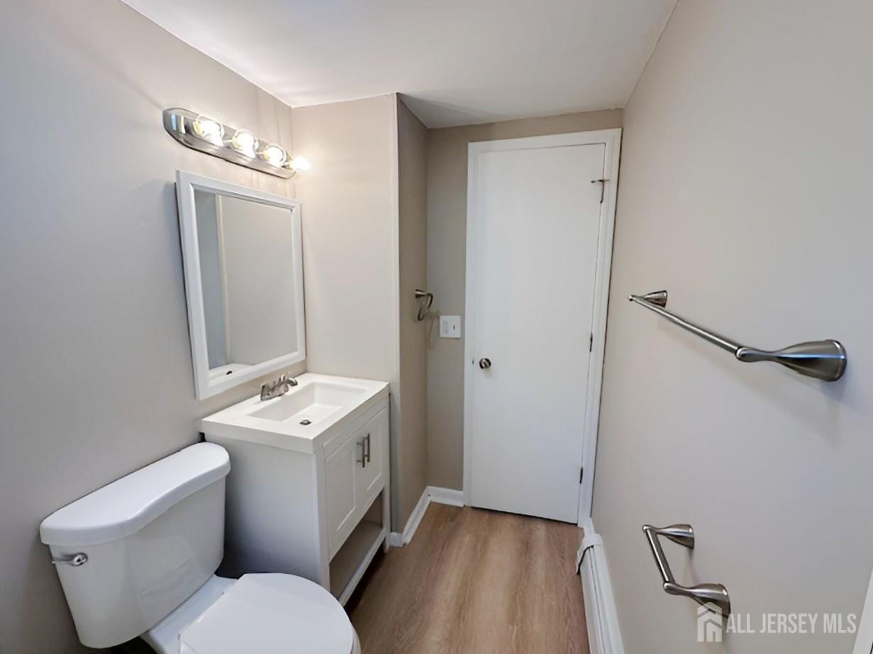 125 Raritan Boulevard Old Bridge, NJ 07735 - Photo 18 of 29 a bathroom with a toilet sink and mirror