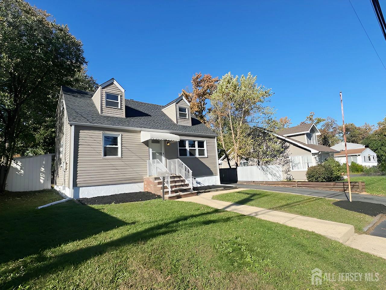 125 Raritan Boulevard Old Bridge, NJ 07735 - Photo 2 of 29 a front view of a house with a yard