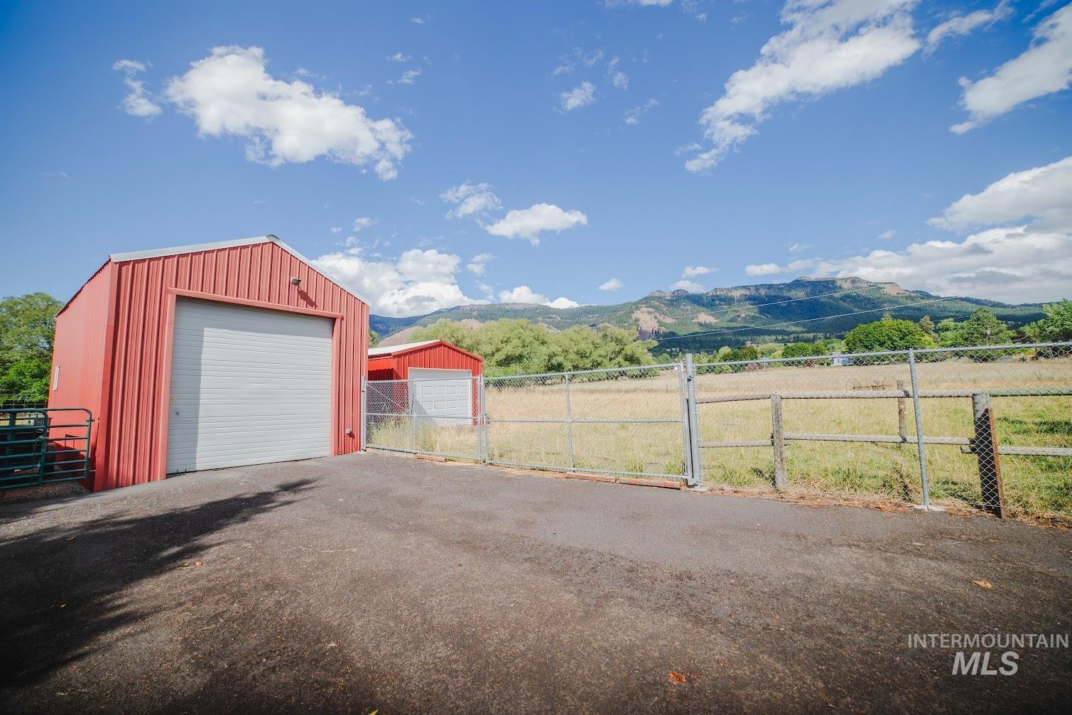 69431 Antles Road, Unit 1 Cove, OR 97824 - Photo 13 of 23 Detached garage featuring a mountain view and a gate