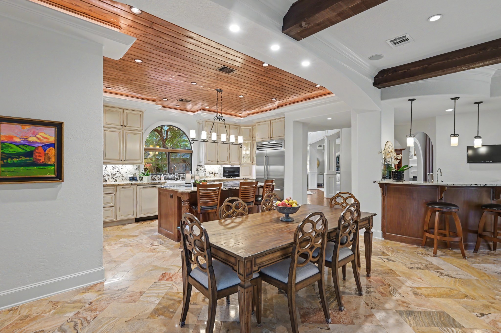 22 Watertree Court Spring, TX 77380 - Photo 11 of 45 Breakfast table that seamlessly flows from the kitchen into the living room.