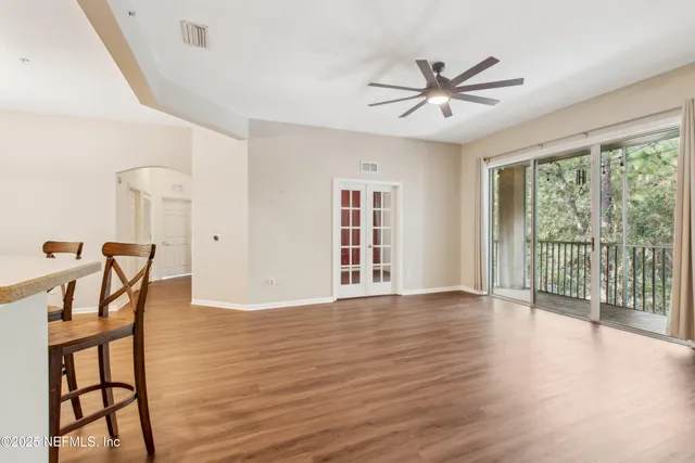 a view of a livingroom with furniture window and wooden floor