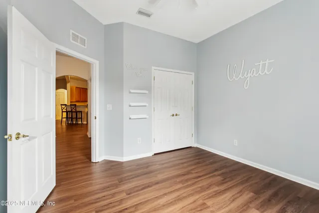 a bedroom with bed and a window