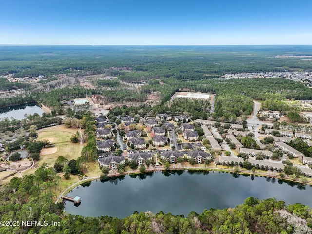 a view of a house with a swimming pool and a fire pit