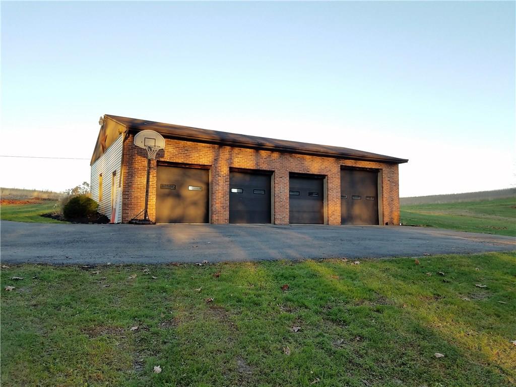 224 Stark Road Sarver, PA 16055 - Photo 2 of 25 4 stall detached garage with ample room for cars, trucks, side-by-sides, 4 wheelers, or to use as a workshop.