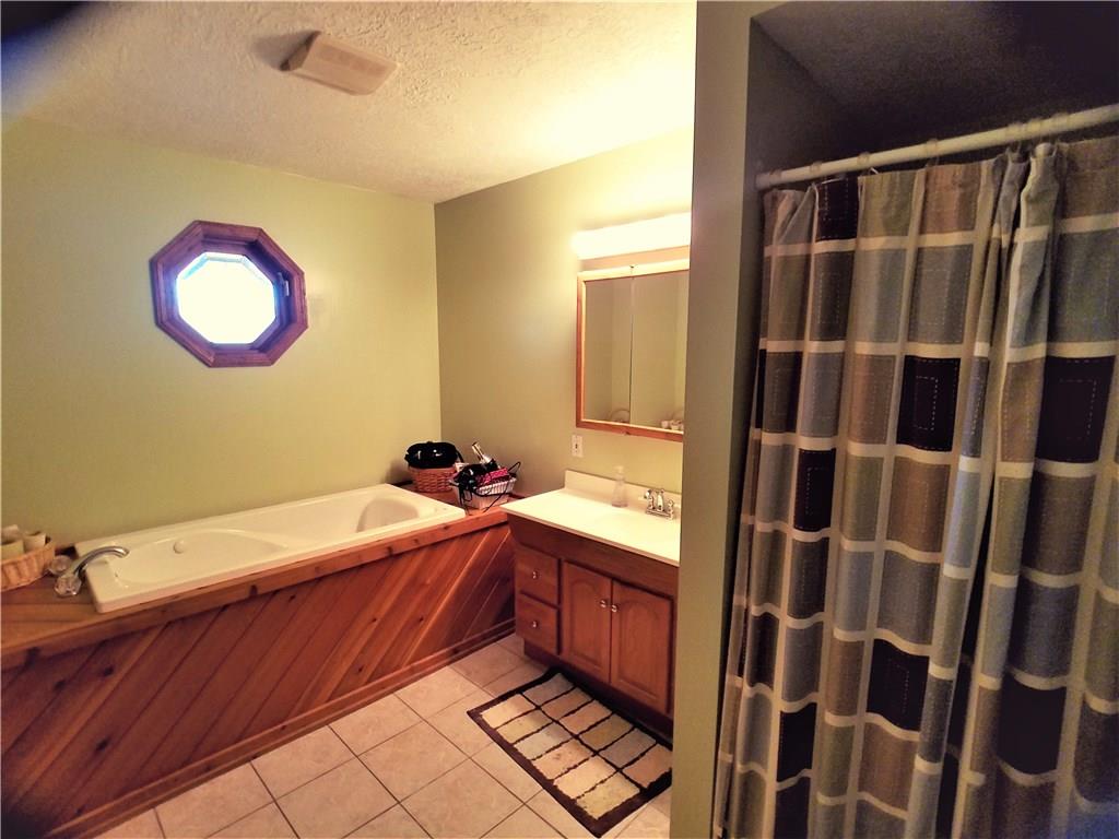224 Stark Road Sarver, PA 16055 - Photo 12 of 25 Large master bathroom offers separate shower and tub.