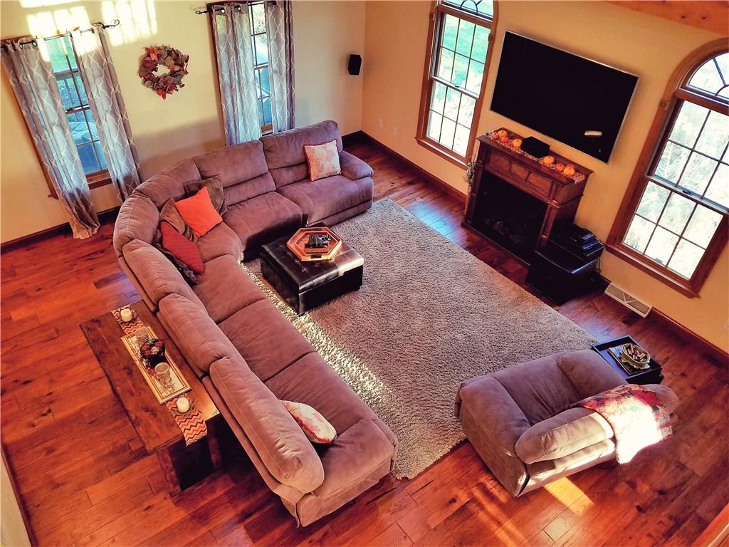 224 Stark Road Sarver, PA 16055 - Photo 9 of 25 Living room offers vaulted ceilings with a view to the upstairs playroom/balcony.
