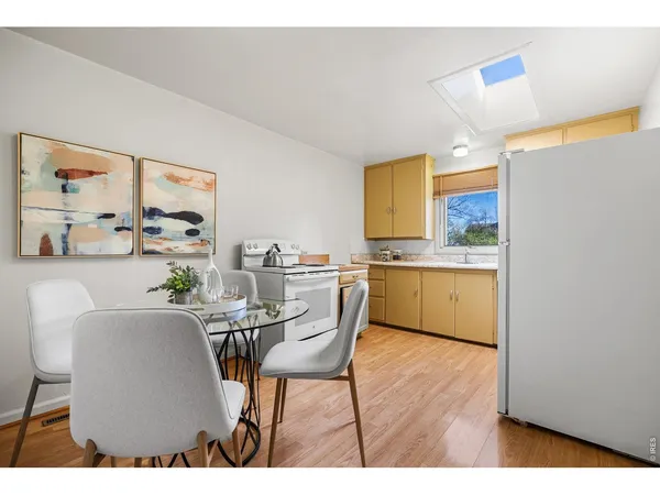 a bedroom with a large bed and a potted plant