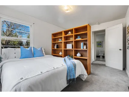 a living room with furniture and potted plant
