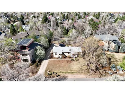 a view of house with outdoor space and sitting area