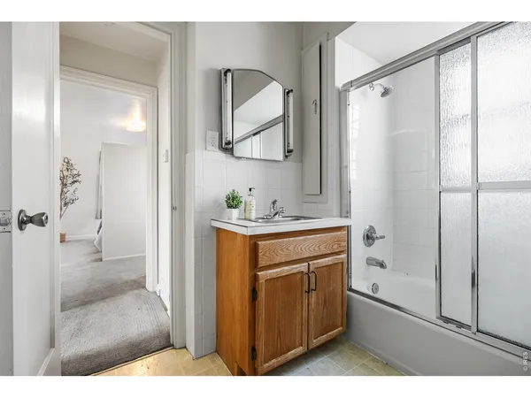 a living room with furniture and a chair