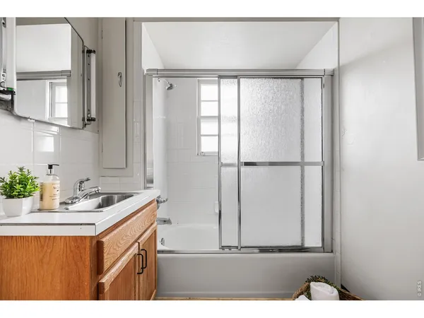 a view of an empty room with stairs