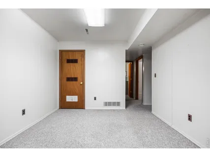 a view of an empty room and window