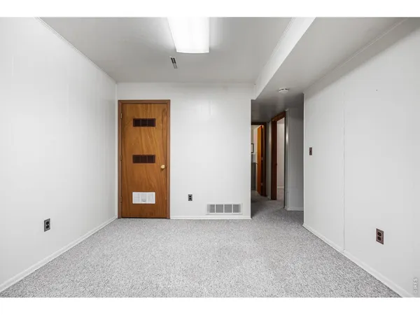 a view of an empty room and window