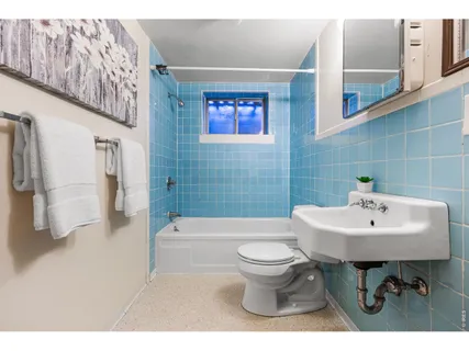 a view of a patio with a table and chairs