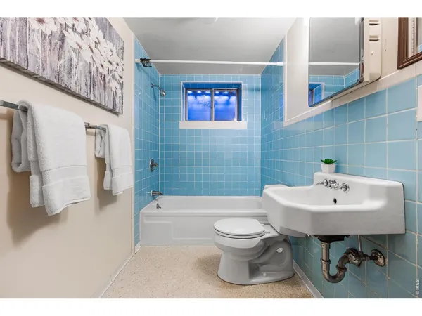 a view of a patio with a table and chairs