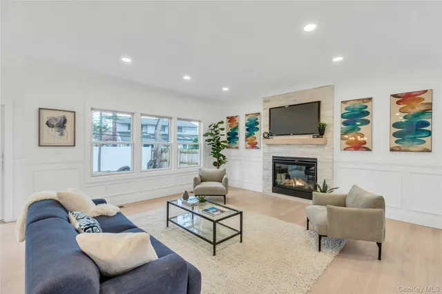 a living room with furniture fireplace and a flat screen tv