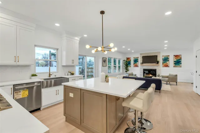 a large kitchen with a table chairs and a refrigerator