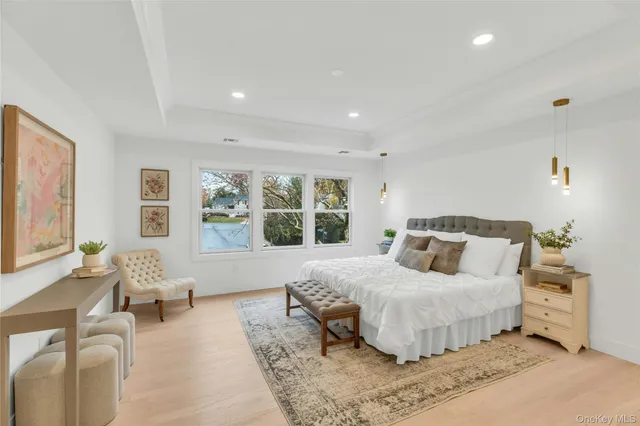 a bedroom with a large bed and a couch