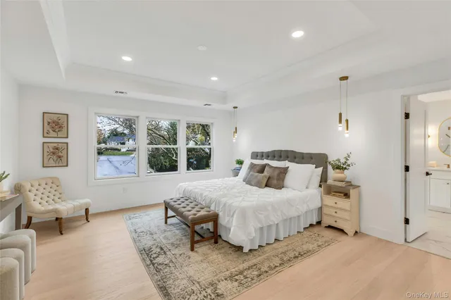 a bedroom with a large bed and a couch