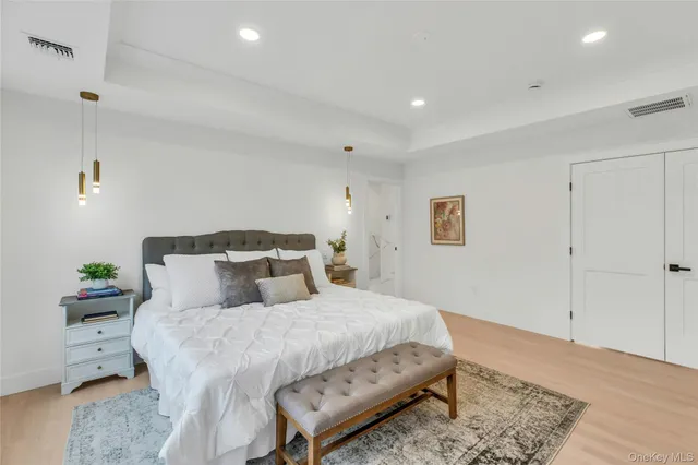 a bedroom with a bed and a couch