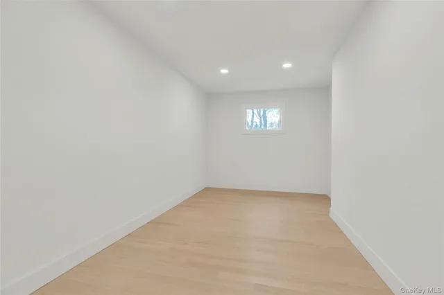 a view of an empty room and a window