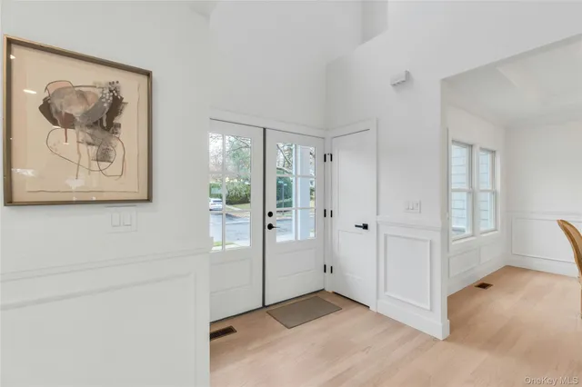a view of a hallway with bathroom