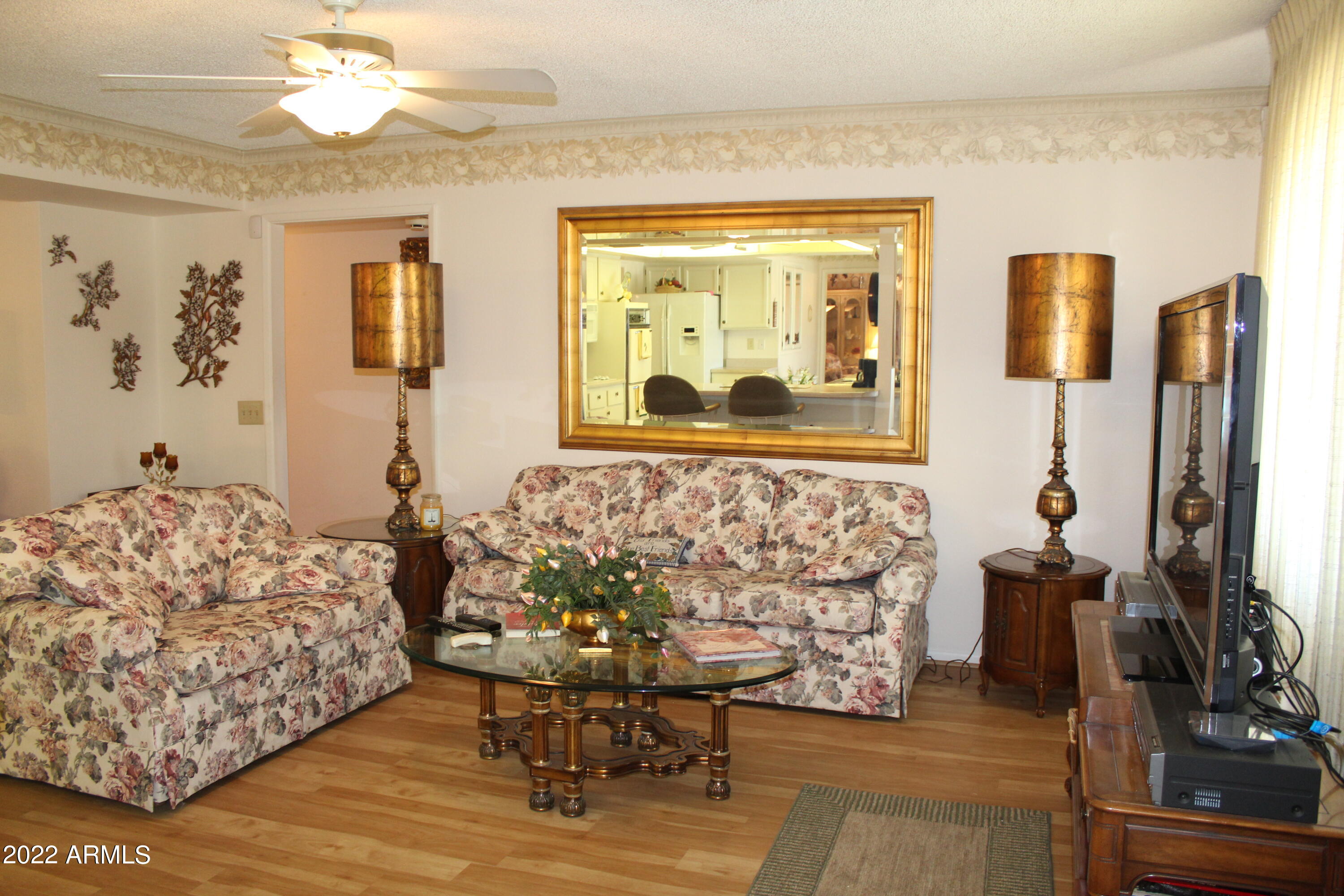 9807 West Mockingbird Drive Sun City, AZ 85373 - Photo 13 of 32 Family Room with large TV