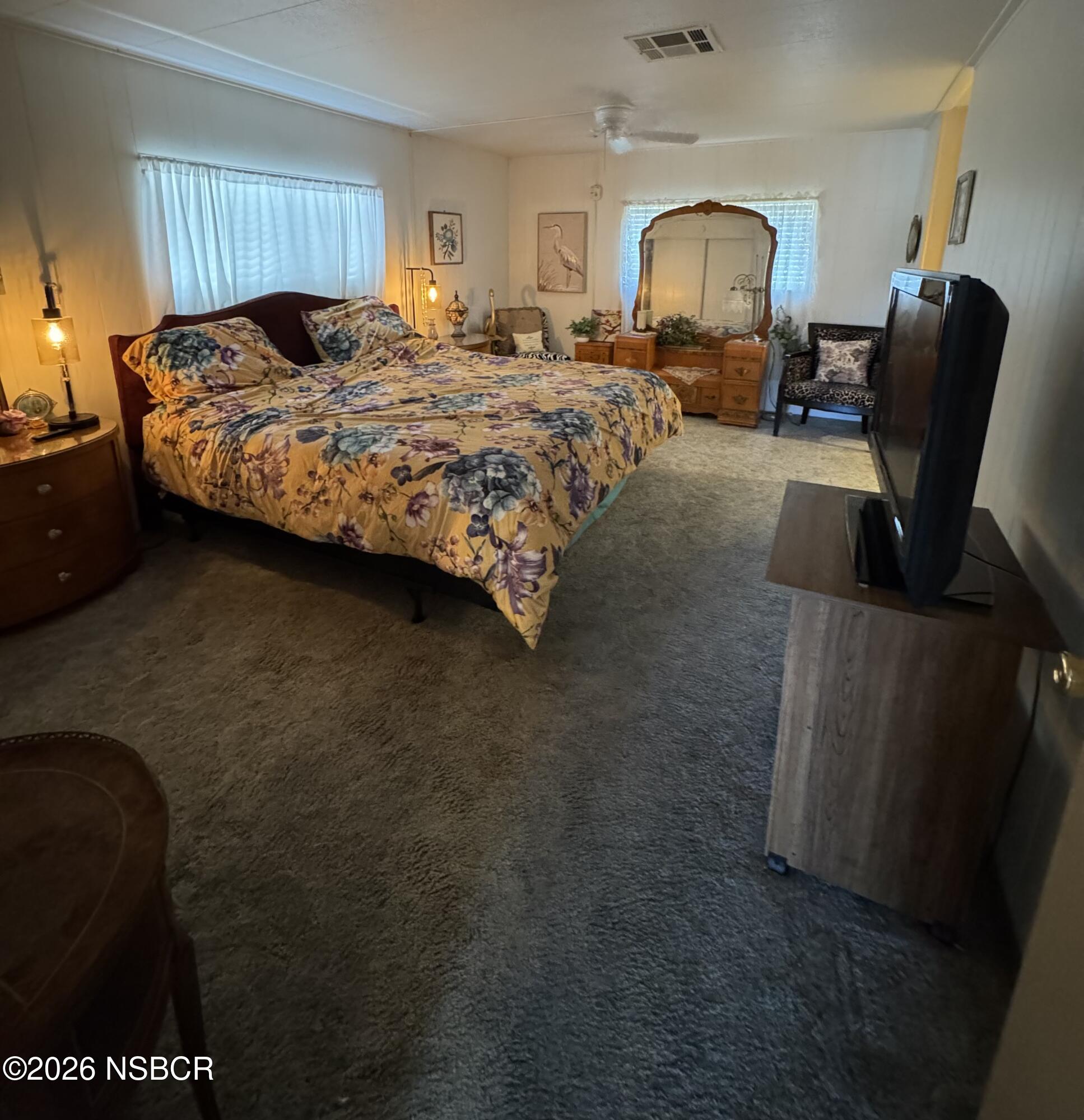 3210 Santa Maria Way, Unit 173 Santa Maria, CA 93455 - Photo 14 of 24 a bed room with a bed furniture and a window