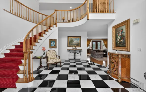 a room with lots of black and white checkered walls and a black white checkered floor