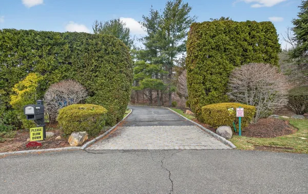 an aerial view of a house with garden space and street view