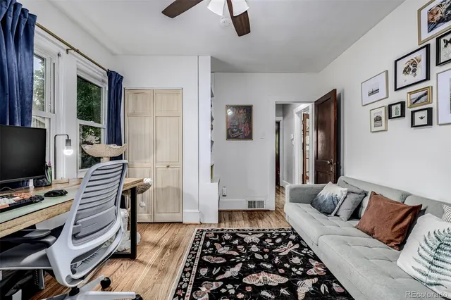 a bedroom with furniture and a rug