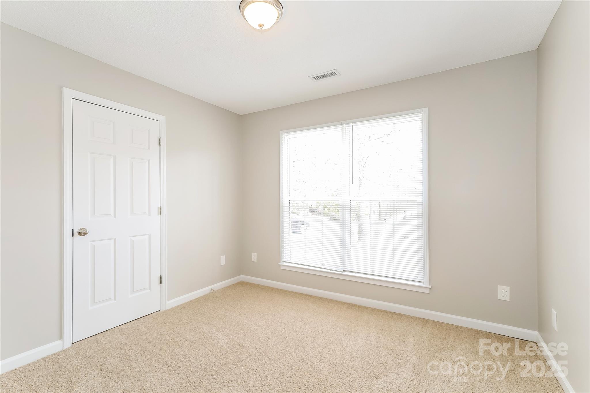 1323 Tucker Road Monroe, NC 28110 - Photo 11 of 16 an empty room with a window