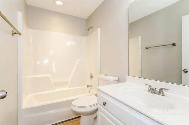 a bathroom with a sink a toilet and a bathtub