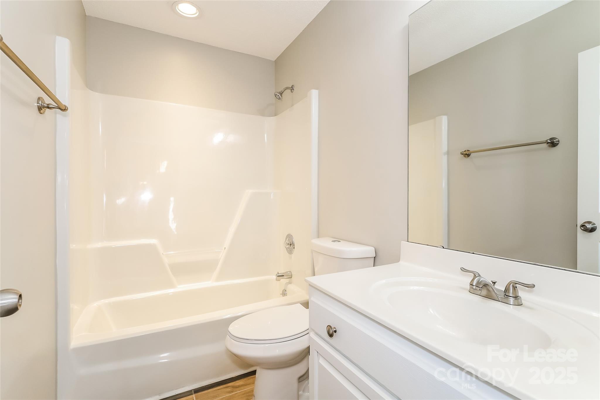 1323 Tucker Road Monroe, NC 28110 - Photo 13 of 16 a bathroom with a sink a toilet and a bathtub