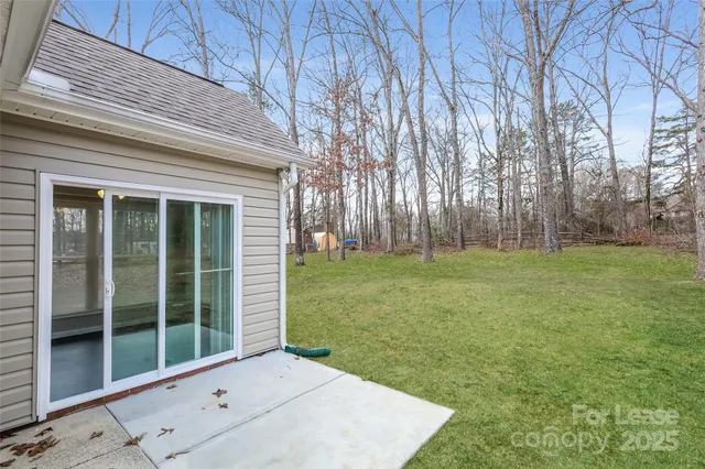 a backyard of a house with lots of green space