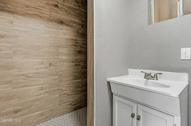 a bathroom with a sink and a mirror