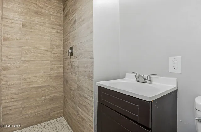 a bathroom with a sink toilet and vanity