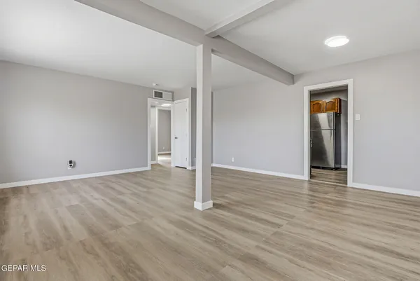 a view of a livingroom with wooden floor