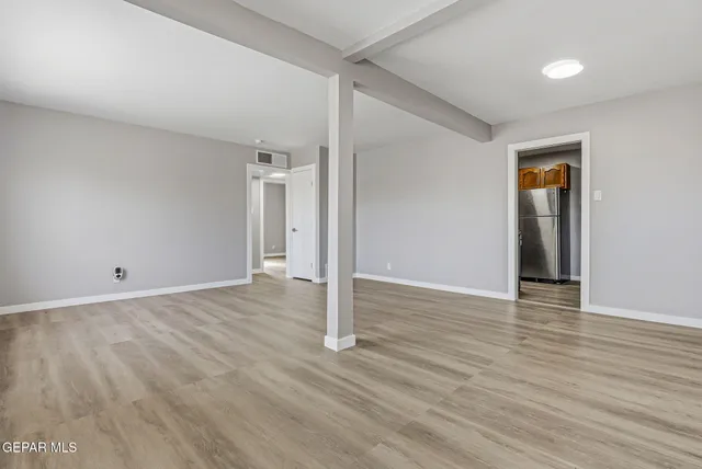 a view of a livingroom with wooden floor