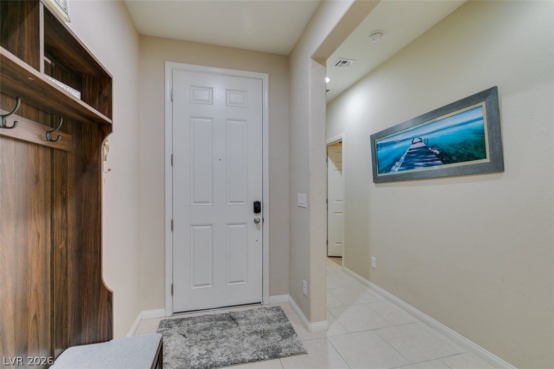 7375 Campbell Ranch Avenue Las Vegas, NV 89179 - Photo 3 of 45 A welcoming entryway features tile flooring.