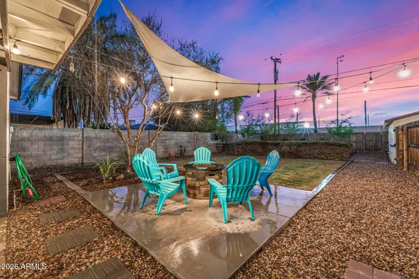 a view of a house with backyard porch and sitting area