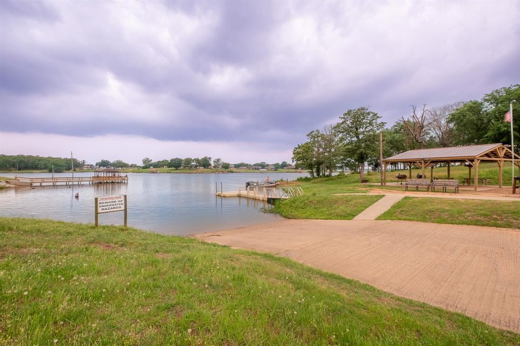 Lot 221-section Lot 221-section H Geronimo Quitman, TX 75783 - Photo 3 of 14 a view of a lake with houses in the background