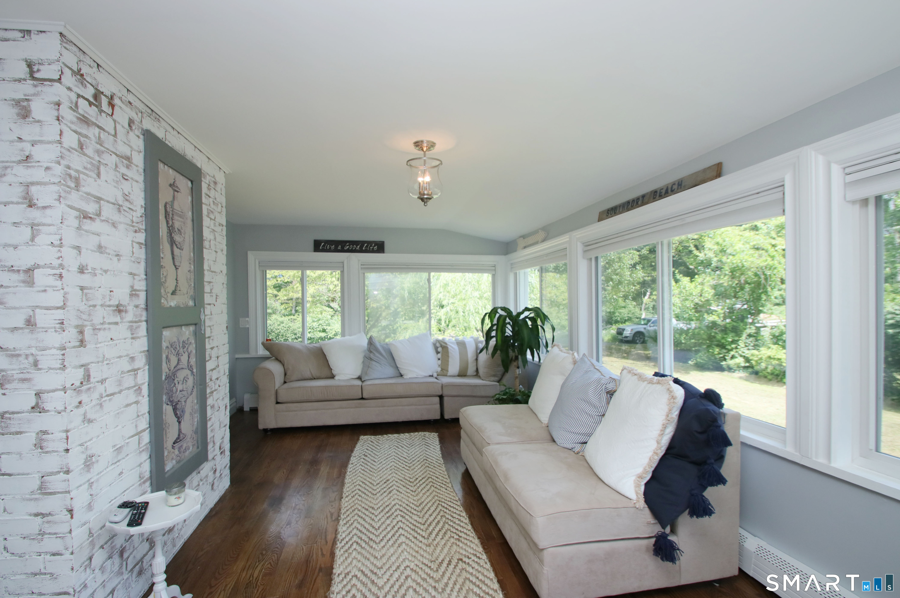 146 Oxford Road Fairfield, CT 06890 - Photo 18 of 31 Window surrounding sun room off the living room