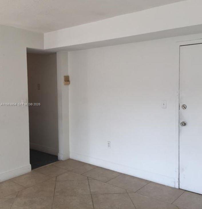 4705 Northwest 7th Street, Unit 2057 Miami, FL 33126 - Photo 2 of 9 a view of an empty room