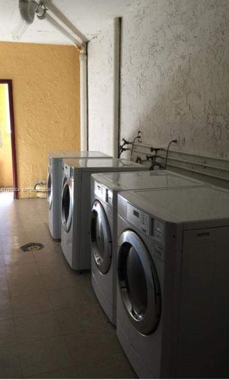 4705 Northwest 7th Street, Unit 2057 Miami, FL 33126 - Photo 7 of 9 a utility room with dryer and washer