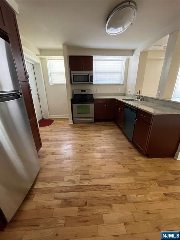 280-320 Oak Street, Unit 306TG Ridgewood, NJ 07450 - Photo 8 of 22 a view of kitchen with wooden floor and electronic appliances