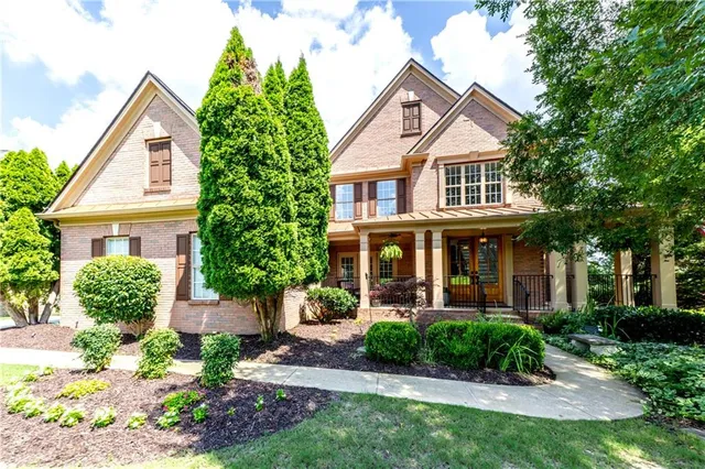 a front view of a house with garden