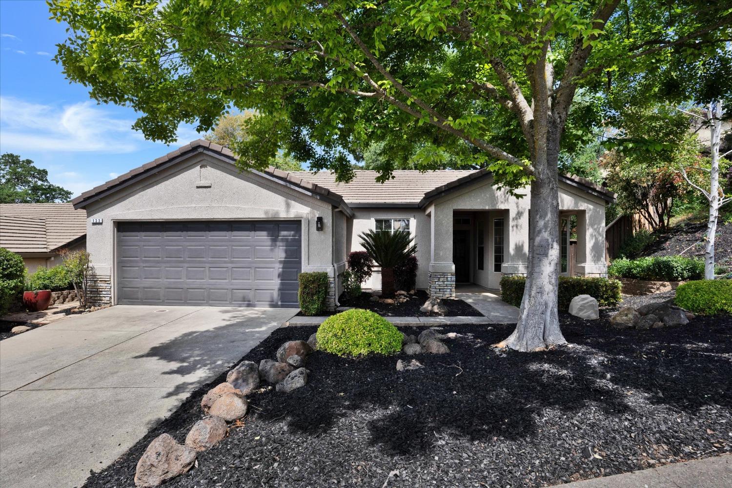 Mature trees high-lite the curb appeal of this cute single level home in California Hills